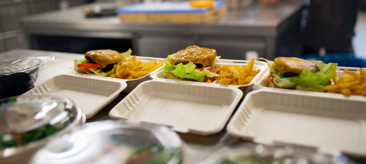 The meals containers prepared for take away in kitchen restaurant.